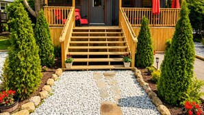 A wooden cabin with a porch, steps leading to the entrance, and a gravel pathway. - New Cottage, Premium Comfort, Blue Ridge Mtns, Ski, Golf (Newland)