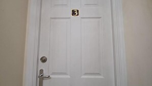 A white door with a number plate indicating room number 3. - The Rookery  (Grays)