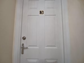 A white door with a number plate indicating room number 3. - The Rookery  (Grays)