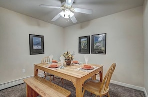 A dining room with a wooden table set for four, a ceiling fan, and framed pictures on the walls. - BARGAIN! -- Up to 8 @ Swan Mtn. Resort Keystone/Dillon 8/8-15 - 40% off 6+ nites (Keystone)