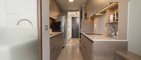 Coffee/tea maker, fridge, microwave, oven