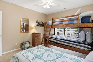 A bunk bed room with a ladder, a dresser, a mirror, and a window with a view. - Private Cove Dock, PWC Lifts, Huge Deck & Family Fun (Climax Springs)