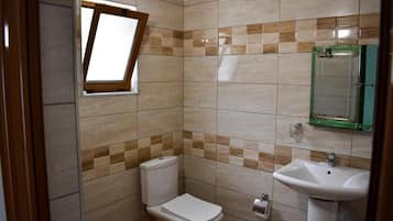 Shower, hair dryer, towels, shampoo