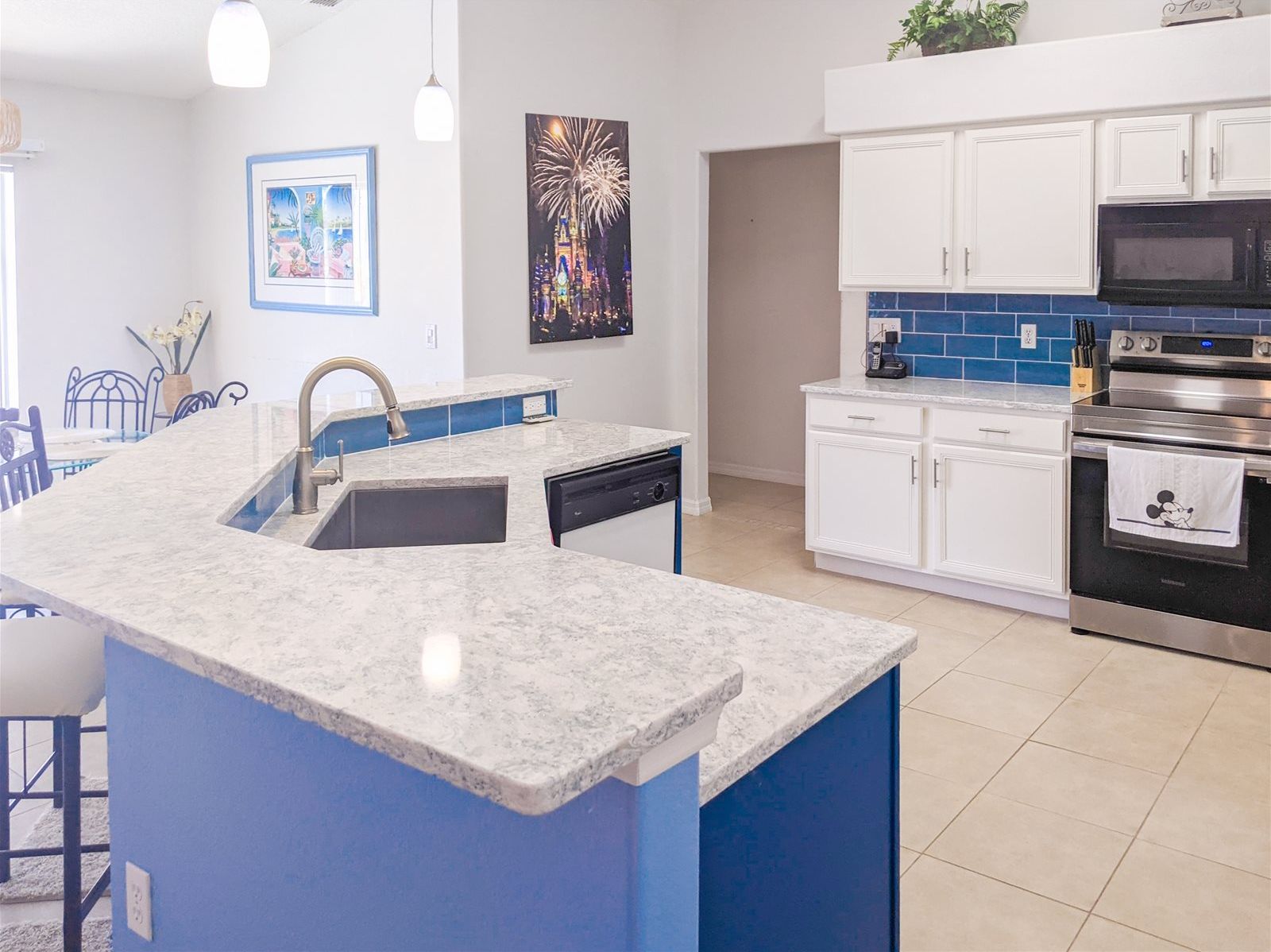 Fully stocked Kitchen with stainless steel appliances, quartz countertops, and breakfast nook.