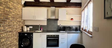 Coffee/tea maker, fridge, microwave