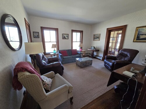 Spacious 6BR waterfront retreat with WiFi, kitchen, and parking.
