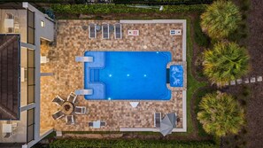 An aerial view of a residential property with a swimming pool, outdoor seating, and a landscaped garden. - Sanctuary at Bears Den, Near Disney, Private Pool, Luxury Golf (Kissimmee)