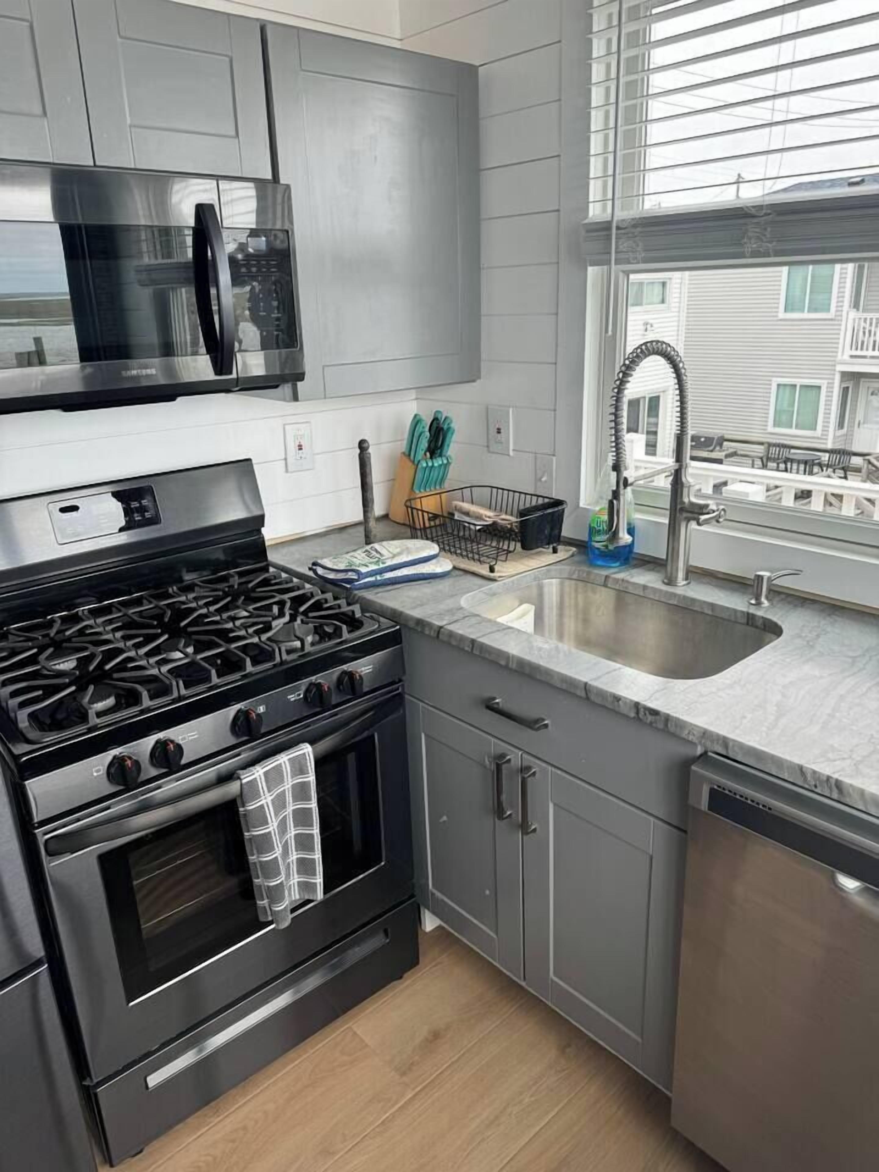 Coffee/tea maker, fridge, cookware/dishes/utensils