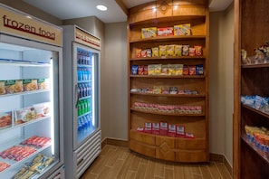 A frozen food section with a variety of snacks and beverages.