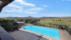 A swimming pool with a view of the countryside. - Red Gum - enjoy superb views in the heart of Merrijig! Sleeps 9 (Merrijig)