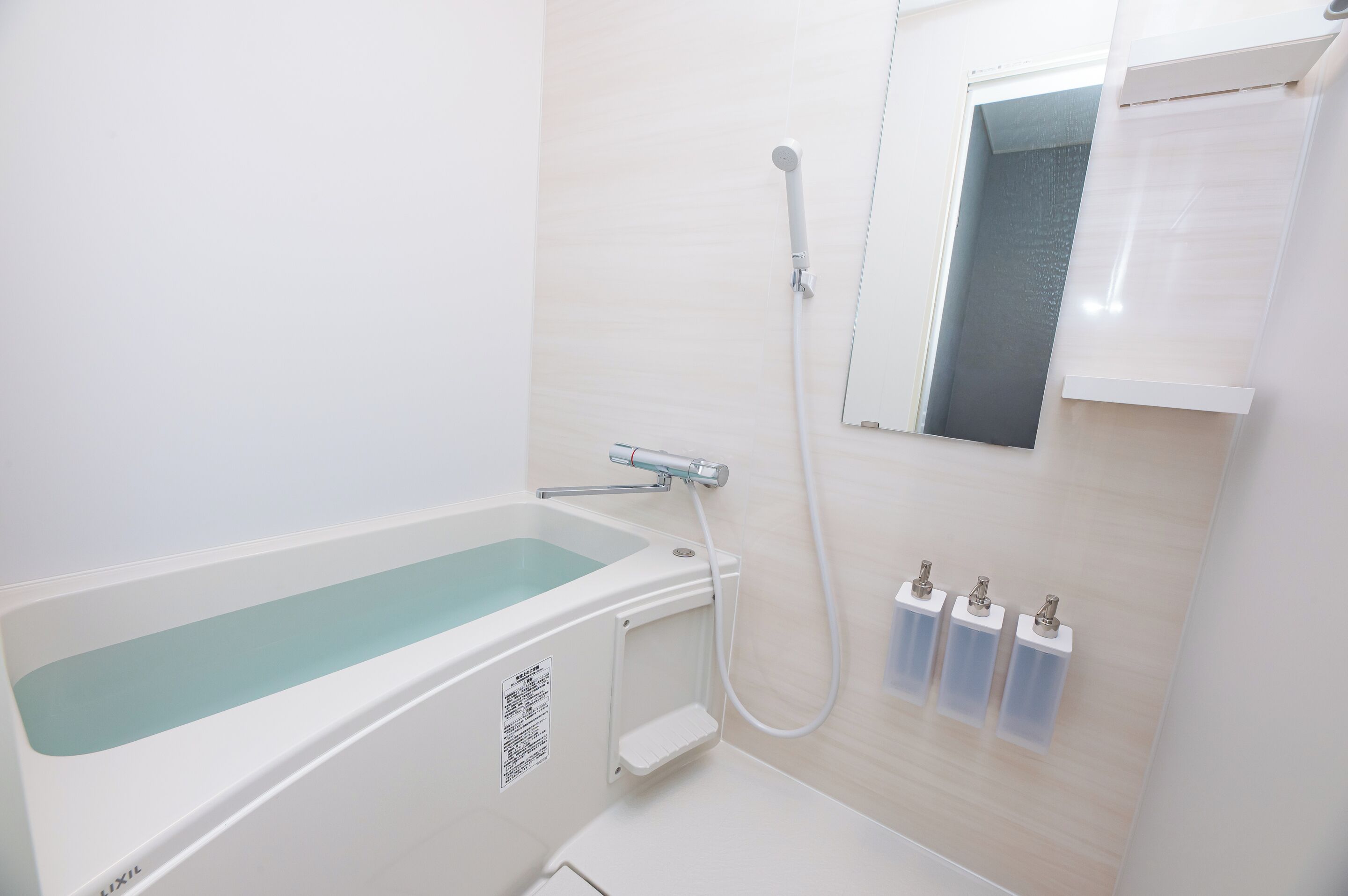 A bathroom with a bathtub, a shower, and a toilet.