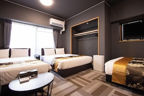 A hotel room with two beds, a small table, an air conditioning unit, a TV, and a window with curtains. - The Lang Hotel Fukuoka (Fukuoka)
