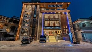 A hotel with a modern facade, a prominent entrance, and a sign indicating the name 'ALIVAA HOTEL'. - Alivaa Hotel, Mcleodganj With Best Dhauladhar View (Dharamshala)