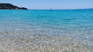 A clear sea with a distant shoreline and a person standing on a buoy. - 1 bedroom nice home in CALCATOGGIO (CALCATOGGIO)