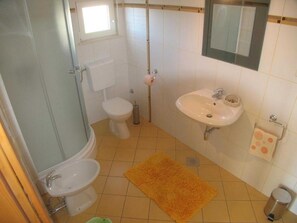 A bathroom with a toilet, sink, and shower. - Apartments Paloc - Standard One-bedroom Apartment With Balcony (Bol)