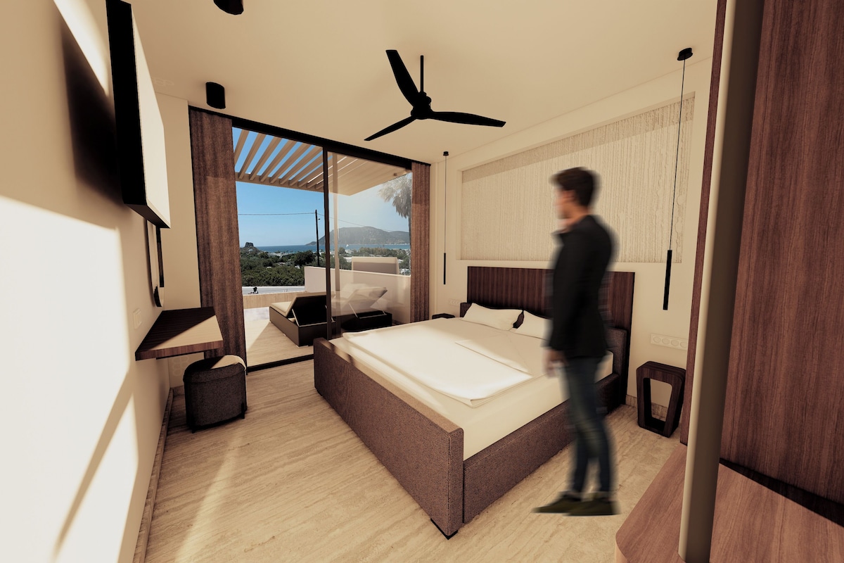A modern bedroom with a large bed, a ceiling fan, and a view of the outdoors.