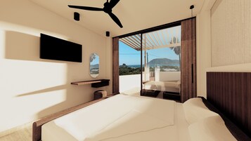 Un dormitorio moderno con cama, televisor montado en la pared, ventilador de techo y un amplio ventanal con vistas al mar y las colinas.