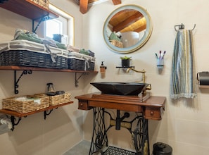 A bathroom with a vintage sink, wooden shelves, a mirror, and a towel rack. - Holiday Home Rider - Two Bedroom Holiday Home With Outdoor Pool (Sibenik)