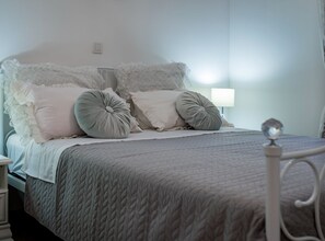 A neatly made bed with a quilted bedspread, two pillows, and a lace headboard. - Holiday Home Rider - Two Bedroom Holiday Home With Outdoor Pool (Sibenik)