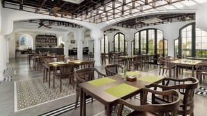 A spacious dining area with high ceilings, large windows, and a modern industrial design. - Bach Dang Hotel (Hai Phong)