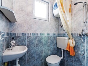 A bathroom with a white sink, a toilet, and a shower with a curtain. - Apartments Hak - Two Bedroom Apartment With Terrace and Sea View (Vir)