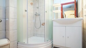 A bathroom with a glass-enclosed shower, a white sink, and a cabinet. - Apartments Ana &amp; Bogdan - Two Bedroom Apartment With Terrace (Postira)