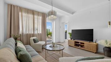 Apartment (Two Bedroom Apartment with Terrace) | Living room | 32-inch flat-screen TV with cable channels
