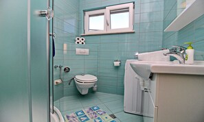 A bathroom with a toilet, sink, and shower. - Apartments Gusti - One Bedroom Apartment With Terrace and Sea View (Janjina)