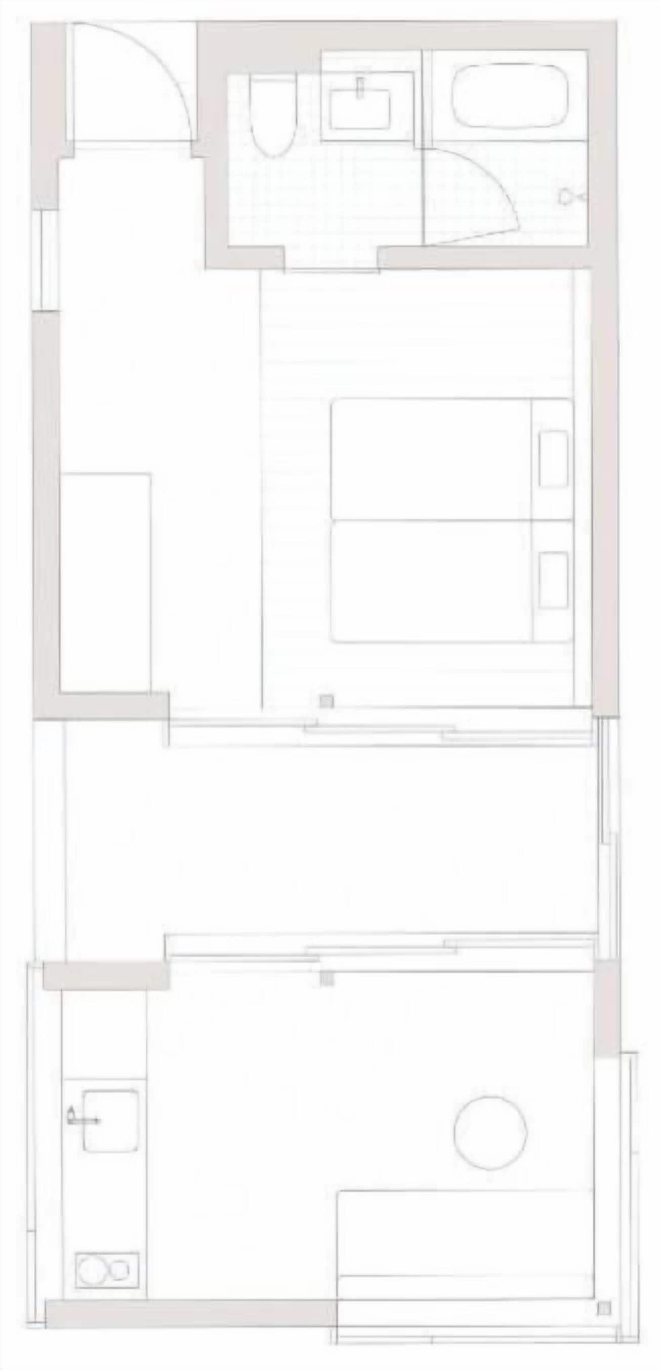 A hotel room layout with a bathroom, a bedroom, and a living area.