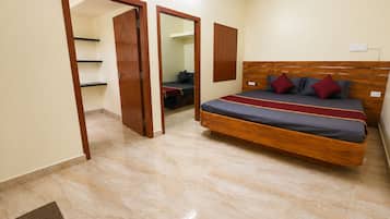 A bedroom with a wooden bed, a wardrobe, and a mirror.