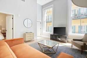 Living room with plush seating and a TV.