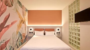 Premium bedding, down comforters, in-room safe, laptop workspace