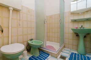 A bathroom with a toilet, bidet, shower, and sink. - Apartments Rasica Molunat - One Bedroom Apartment (Konavle)