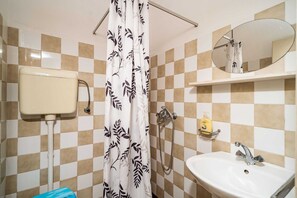 A bathroom with a toilet, sink, shower, and a mirror. - Apartments Klis -two-bedroom Apartment With Terrace (Zupa dubrovacka)