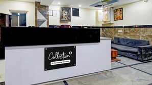 A reception area with a sign indicating 'Collection' and 'Company-Served'. - Super Collection O Khajaguda Hills (Hyderabad)