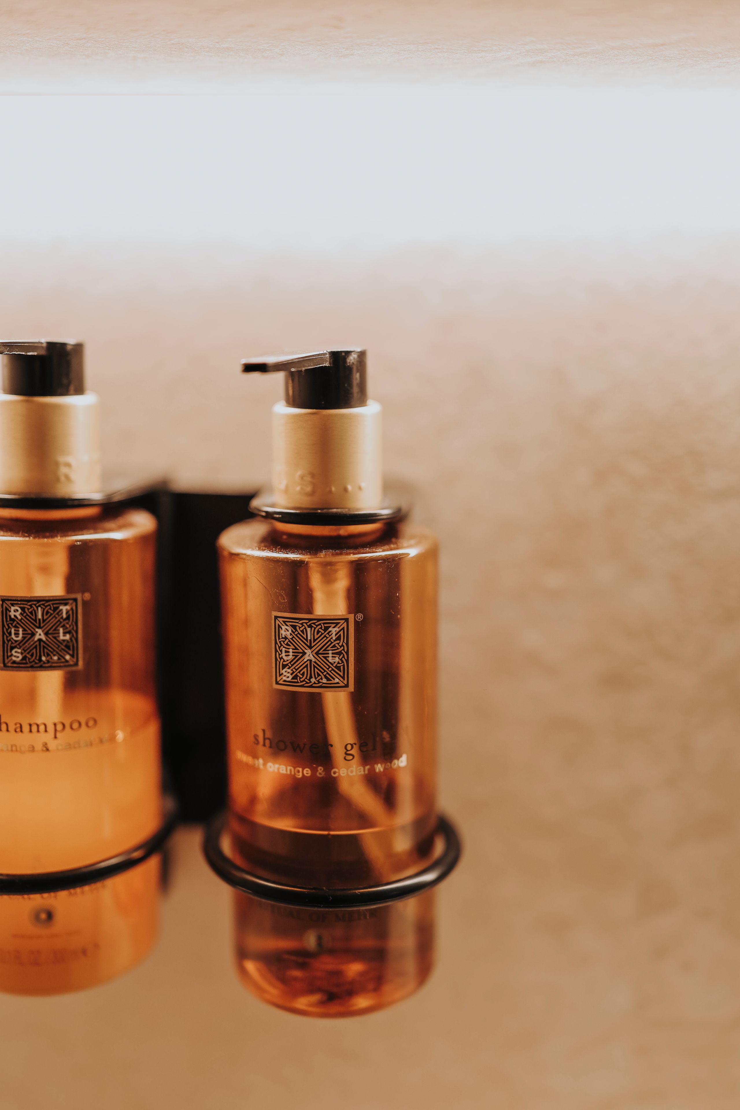 Two bottles of shampoo with pump dispensers.