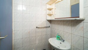 A bathroom with a white sink, a mirror, and a handrail. - Apartments Klis -studio Apartment With Terrace - 2 (Zupa dubrovacka)