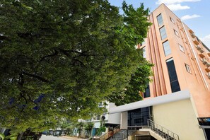 A multi-story building with a modern architectural style, featuring a flat roof and large windows. - Super Collection O Madhapur (Hyderabad)
