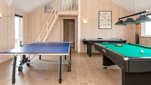 A room with a ping pong table, a pool table, and a staircase leading to an upper level. - Pet friendly home in Harboøre with sauna (Harboøre)