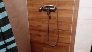 A shower with a handheld showerhead and a flexible hose. - Apartments Franka Saplunara-triple Room With Terrace and Sea View No1 (Mljet)