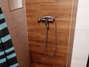 A shower with a handheld showerhead and a flexible hose. - Apartments Franka Saplunara-triple Room With Terrace and Sea View No1 (Mljet)