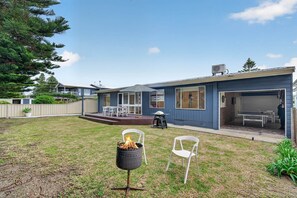 A residential property with a deck, outdoor seating, and a barbecue grill. - Beach and Birdies at Goolwa (Goolwa South)