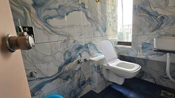 Deluxe Double Room, City View | Bathroom | Shower, free toiletries, towels, soap