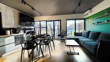 Villa 2, Lake View | Living area | 182-cm Smart TV with cable channels, fireplace, Netflix
