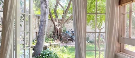 French doors provide garden access direct from the bedroom...
