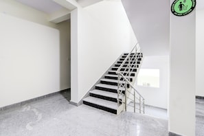 A staircase with metal railings leading to a landing. - Super Collection O Vanasthalipuram (Hyderabad)
