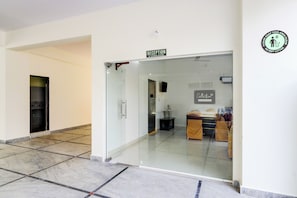 A reception area with a glass door, a reception desk, and a sign indicating 'Reception' above it. - Super Collection O Vanasthalipuram (Hyderabad)