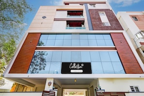 A modern building with a large glass facade and a sign that reads 'Collection'. - Super Collection O Vanasthalipuram (Hyderabad)
