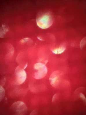 A red surface with circular patterns. - Abcdefghil (Termoli)