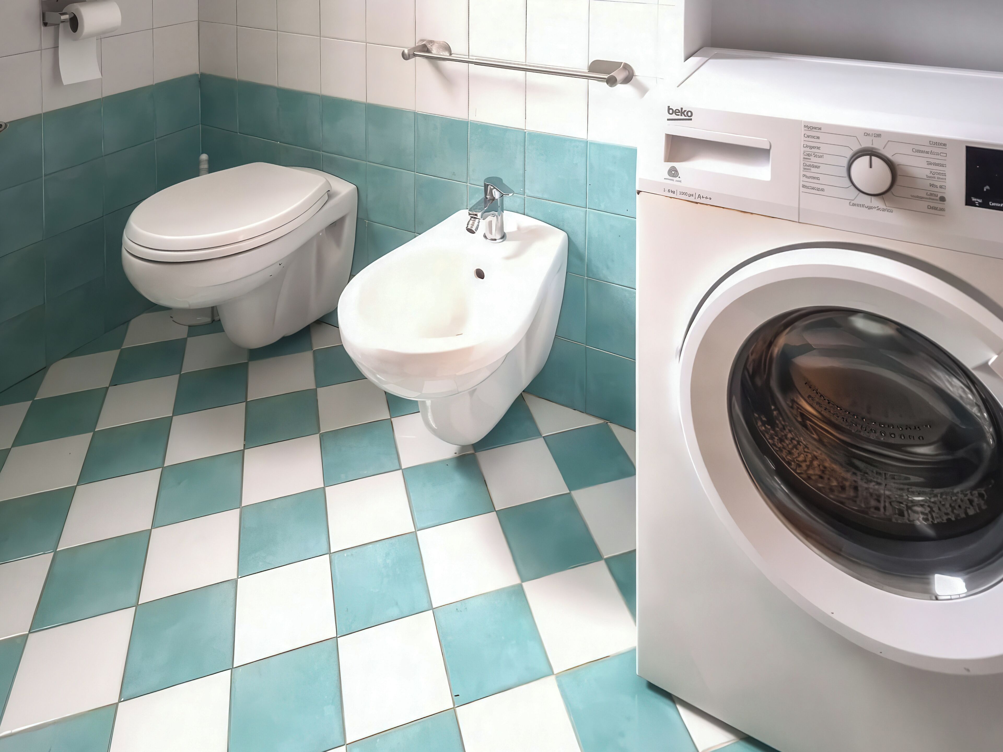 Un baño con inodoro, bidé y lavadora.